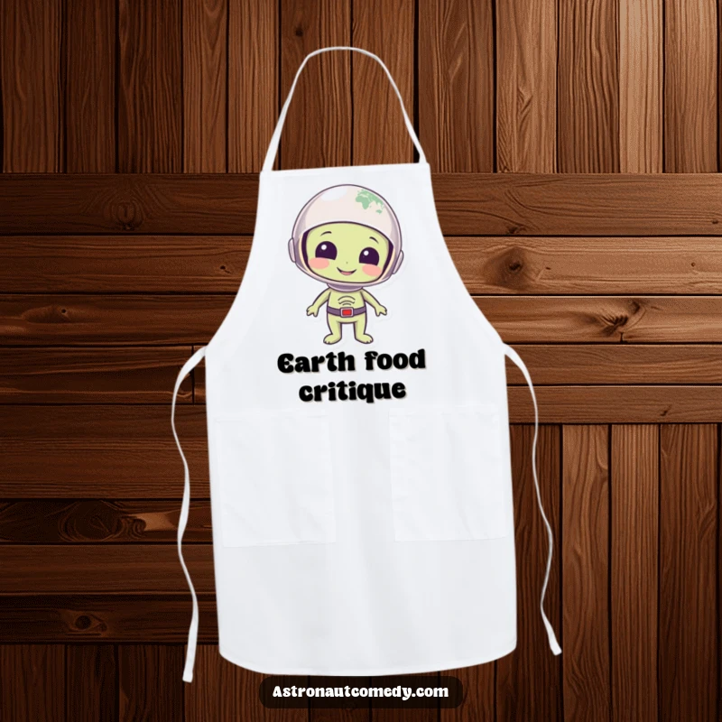Funny apron with a smiling alien in a helmet looking at planet Earth with eyes full of wonder, ready to cook.