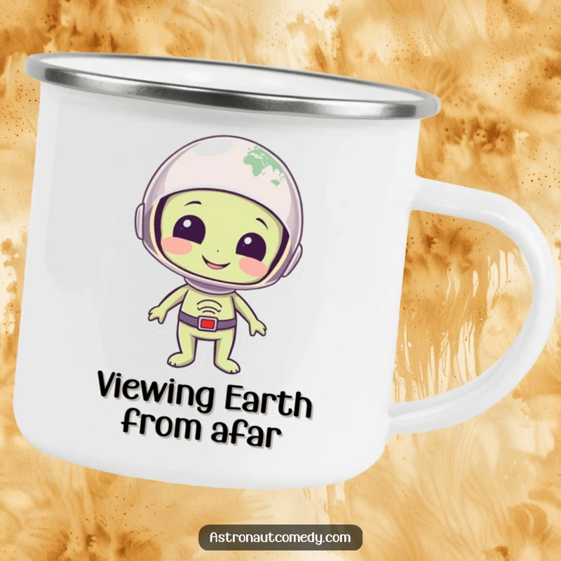 Funny camping mug with a smiling alien in a helmet looking at planet Earth with wonder, designed for outdoor use.