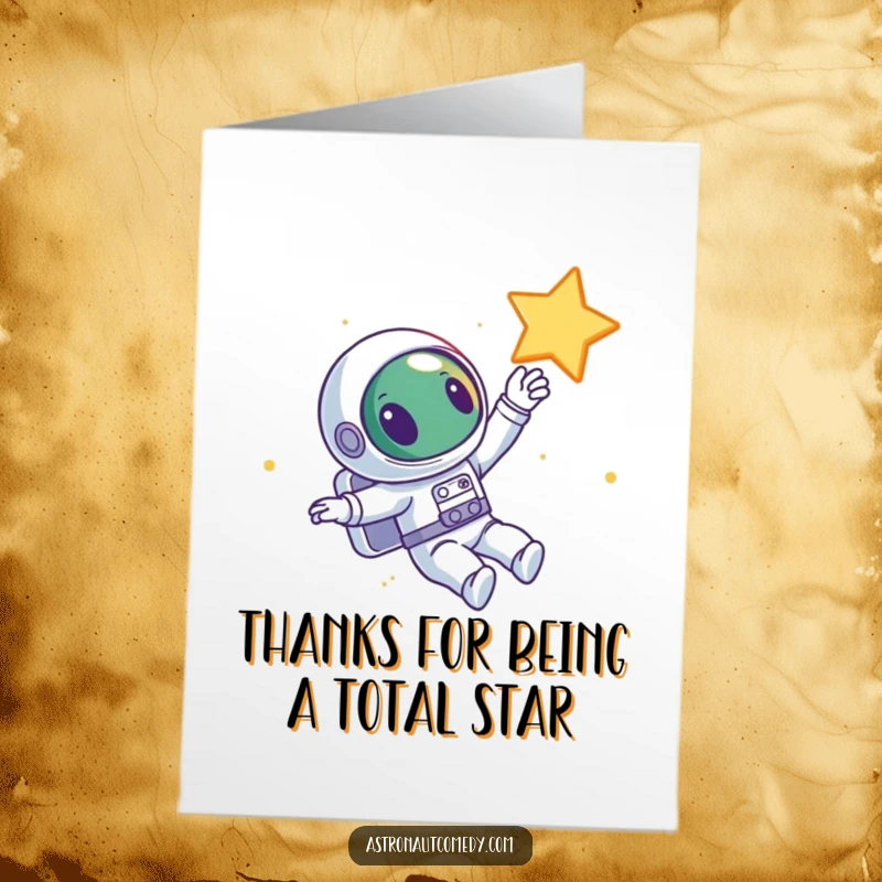 Funny Free Printable Thank You Card: a curious alien astronaut floating in space, joyfully reaching for a bright star.
