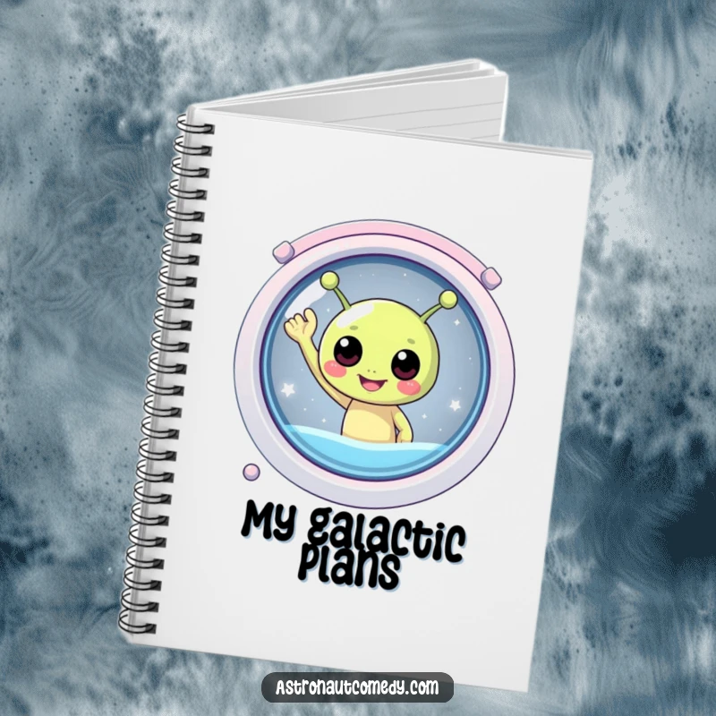 Funny notebook with a round, friendly alien waving hello from the window of a spaceship, ideal for journaling.