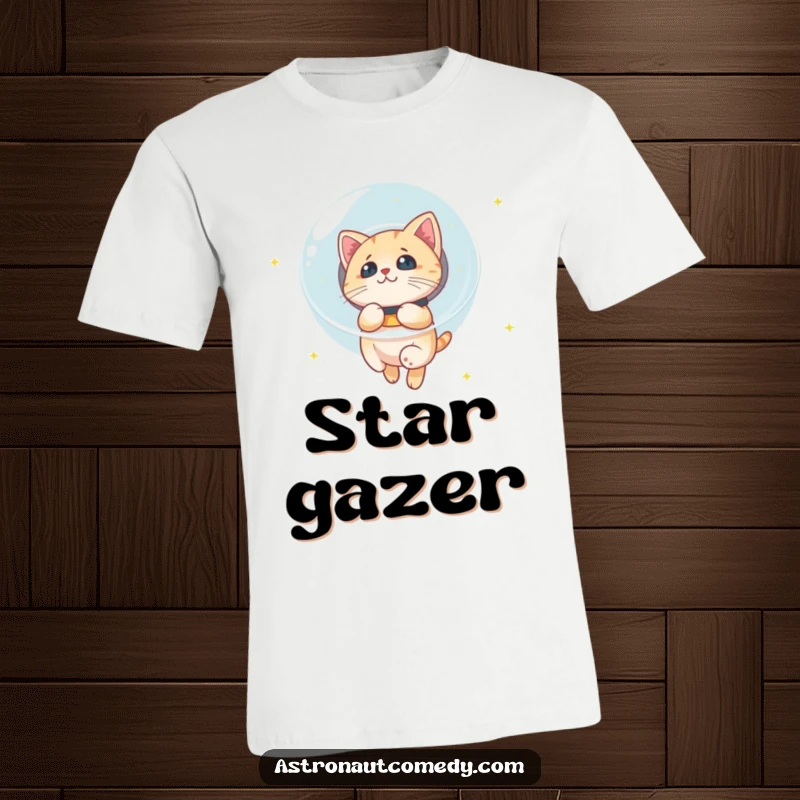 Funny t-shirt graphic of a curious cat in a bubble helmet floating in space, mesmerized by twinkling stars.
