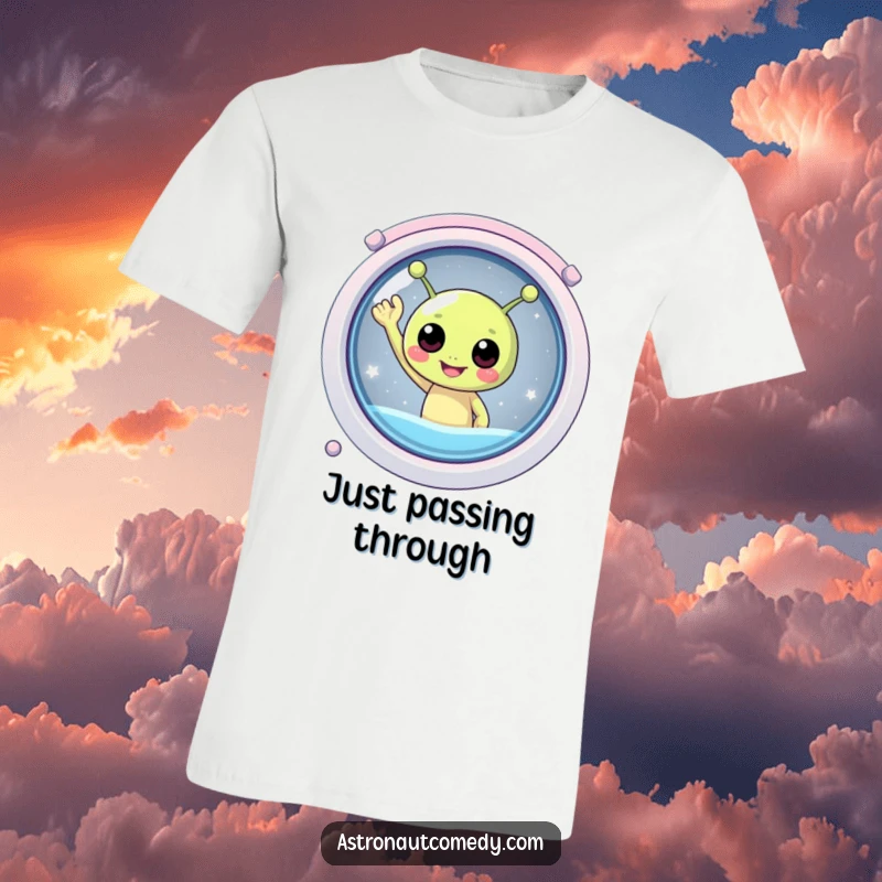 Funny t-shirt showcasing a very happy, round alien with antennae joyfully waving from the window of a sleek spaceship.